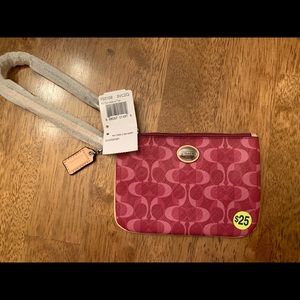Coach wristlet with tags